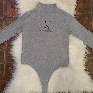 Grey long sleeve bodysuit from Calvin Klein.